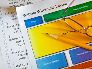 Image of a website design wireframe and CSS code